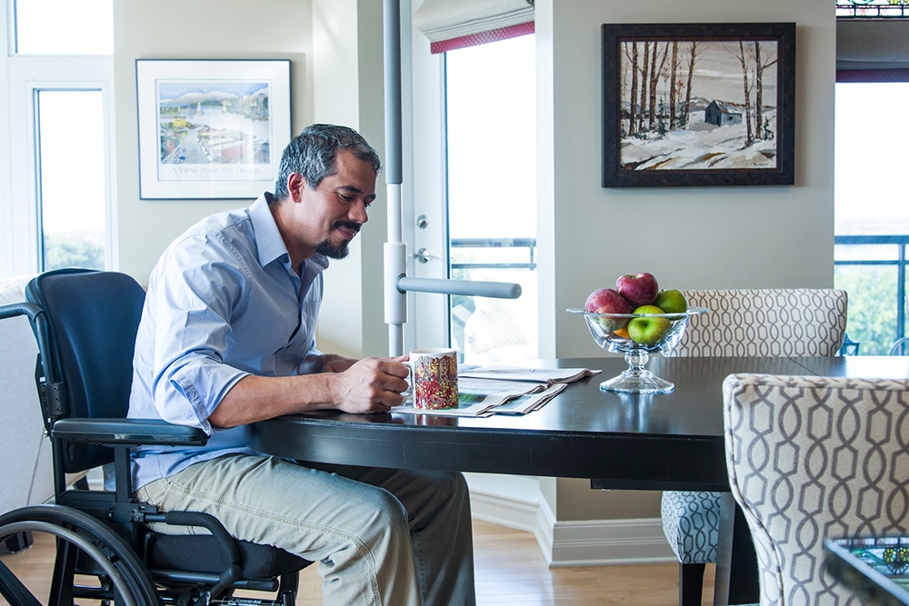 Man sitting at the table with a SuperBar beside him