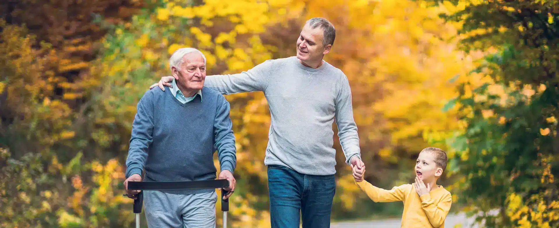 A multi-generational family walking and talking together.